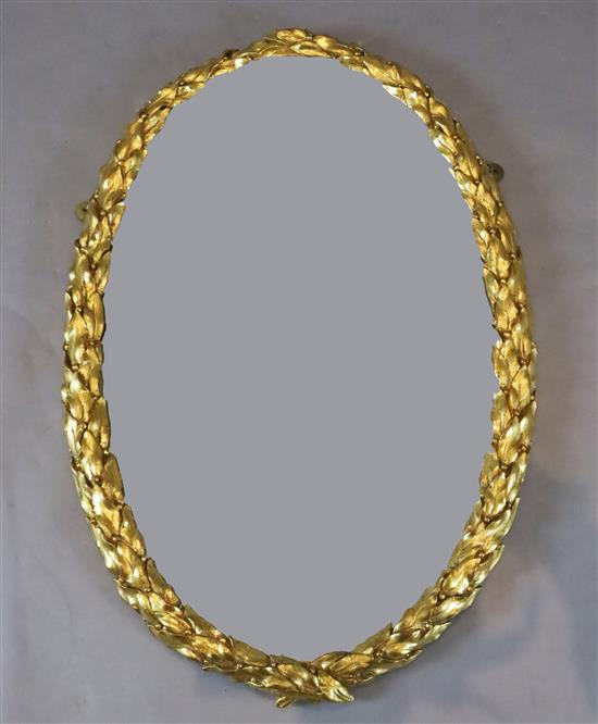 An early 19th century giltwood and gesso oval wall mirror, W.1ft 10in. H.2ft 9in.